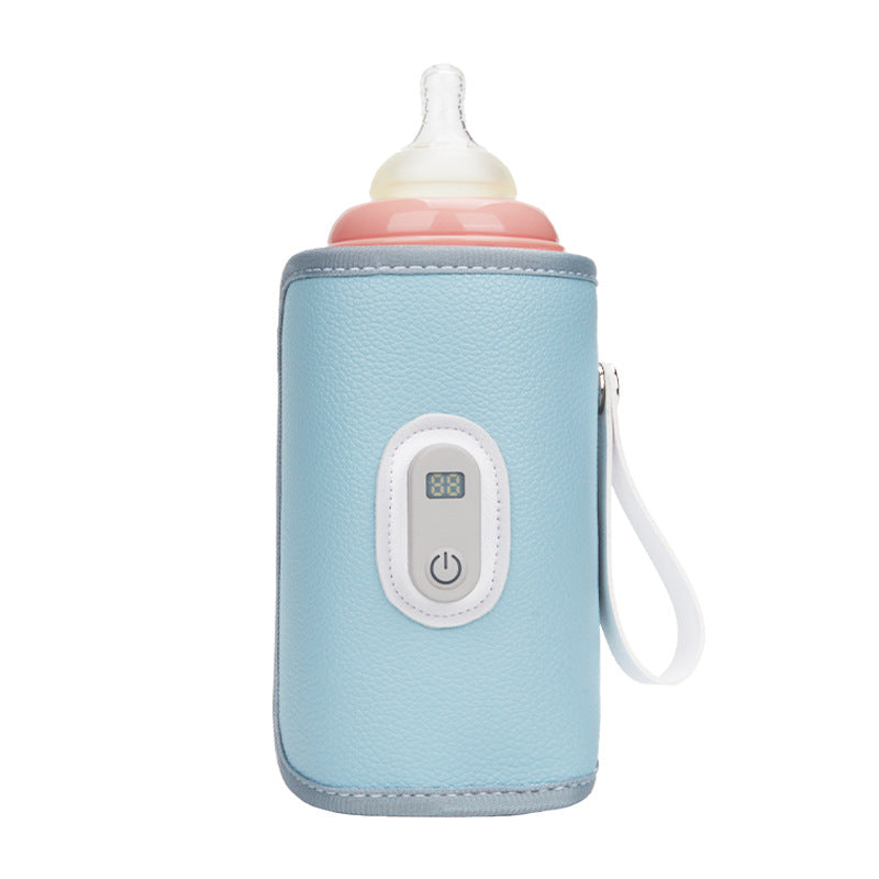 Light blue portable smart baby bottle warmer with digital display, power button, and white strap.