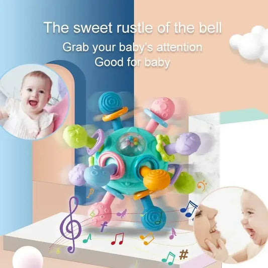 Colorful silicone spinning rattle ball for babies, with textured arms for sensory play.