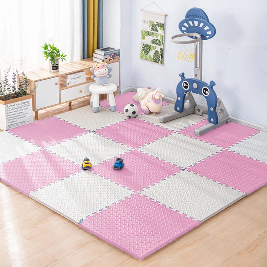 Pink and white checkered foam puzzle play mat for babies in a playroom.