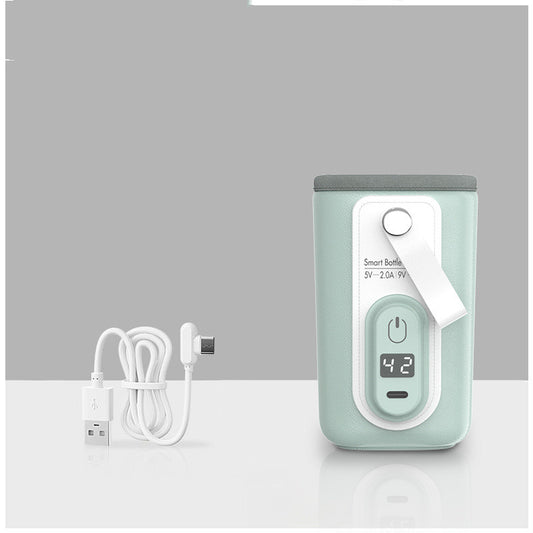 Mint green portable USB bottle warmer with digital display and white charging cable.