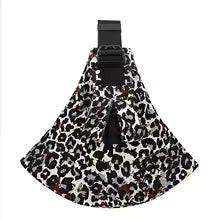 Ergonomic leopard print baby carrier with wide black shoulder strap and buckle.