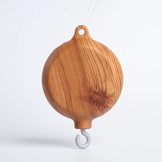 Wooden musical crib mobile base with natural wood grain and a gray hook.