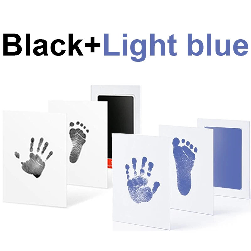 Black and light blue no-ink baby handprint and footprint kits with white cards.
