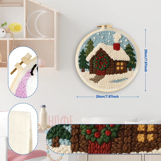 Punch needle embroidery kit with a cozy winter cabin and snowy landscape in a 20cm wooden hoop.