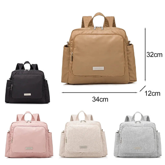 Waterproof diaper backpack in beige, black, pink, cream, and grey with large capacity and smart compartments.