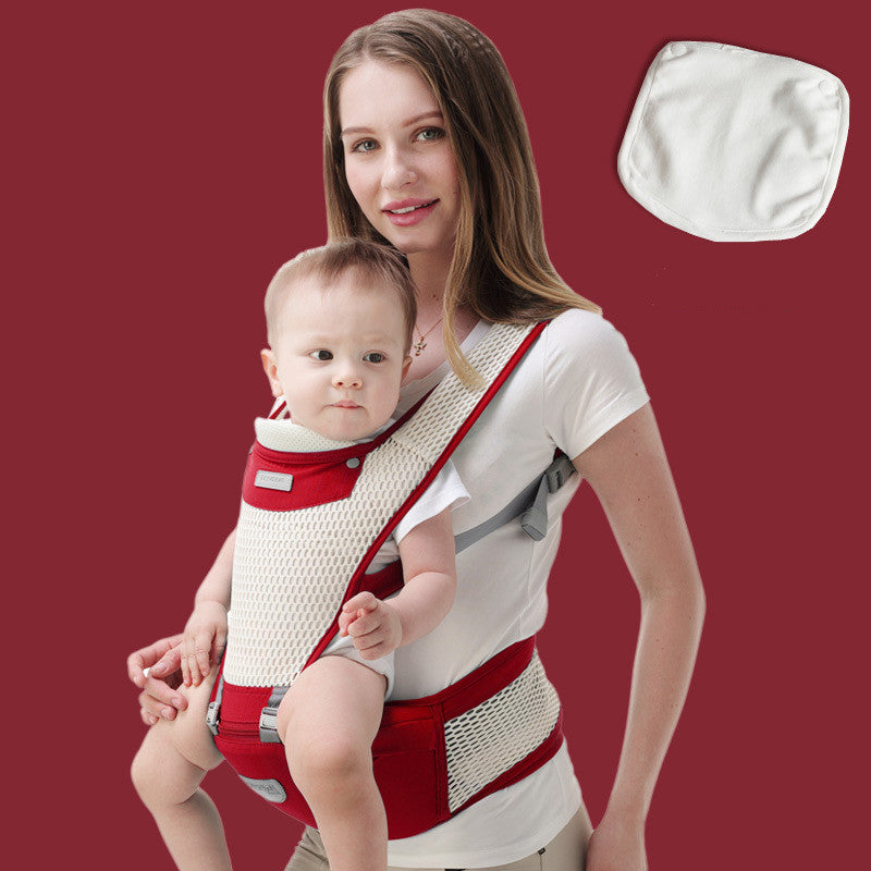 Woman carrying a baby in a red and white ergonomic hip baby carrier with breathable mesh.