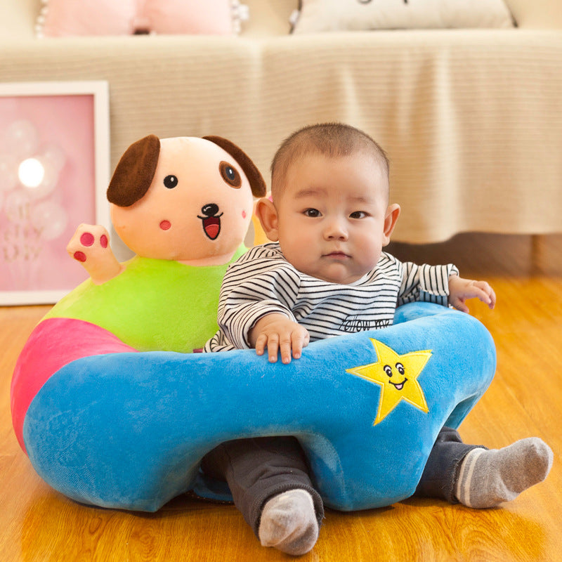 Plush blue baby support seat with a yellow star and a colorful dog toy, supporting a baby.