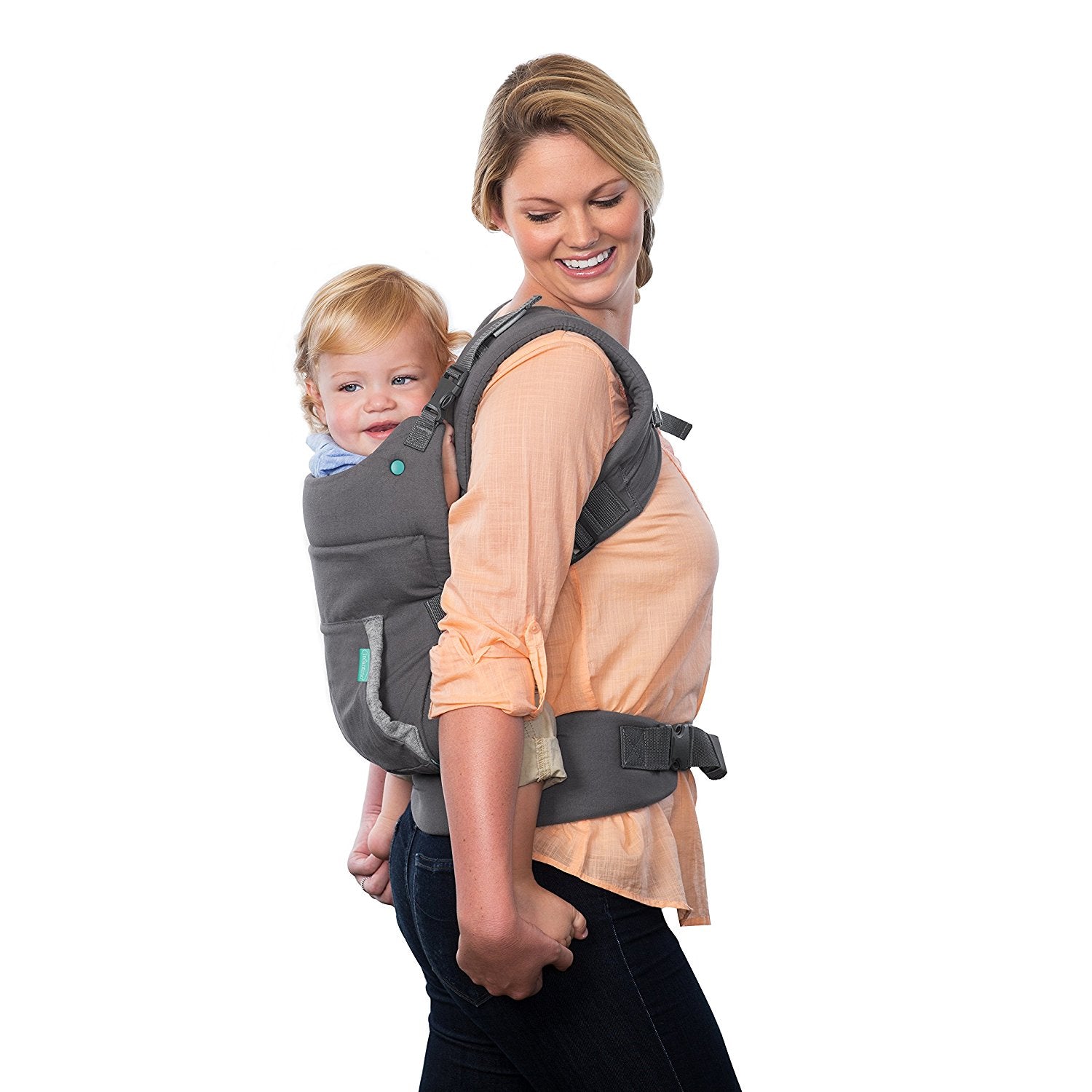 Woman carrying a happy baby in a gray ergonomic, breathable front-facing baby carrier.