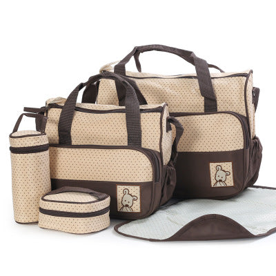 Beige and brown polka dot 5-piece diaper bag set with changing pad, bottle holder, and small bags.