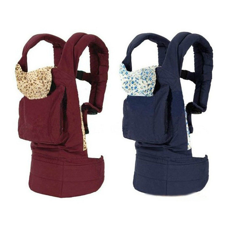 Ergonomic cotton baby carrier in maroon and navy blue with floral print head support.