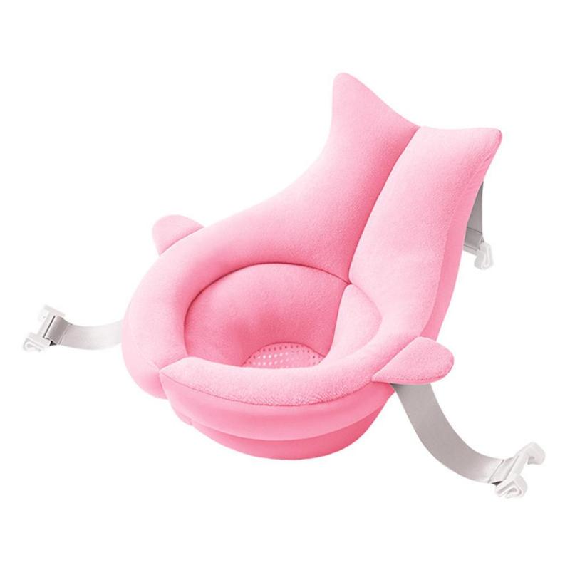 Pink floating baby bath mattress with soft, breathable fabric and adjustable straps for secure bathing.