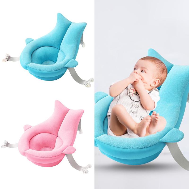 Soft blue and pink floating baby bath cushions with straps; baby rests comfortably in the blue one.
