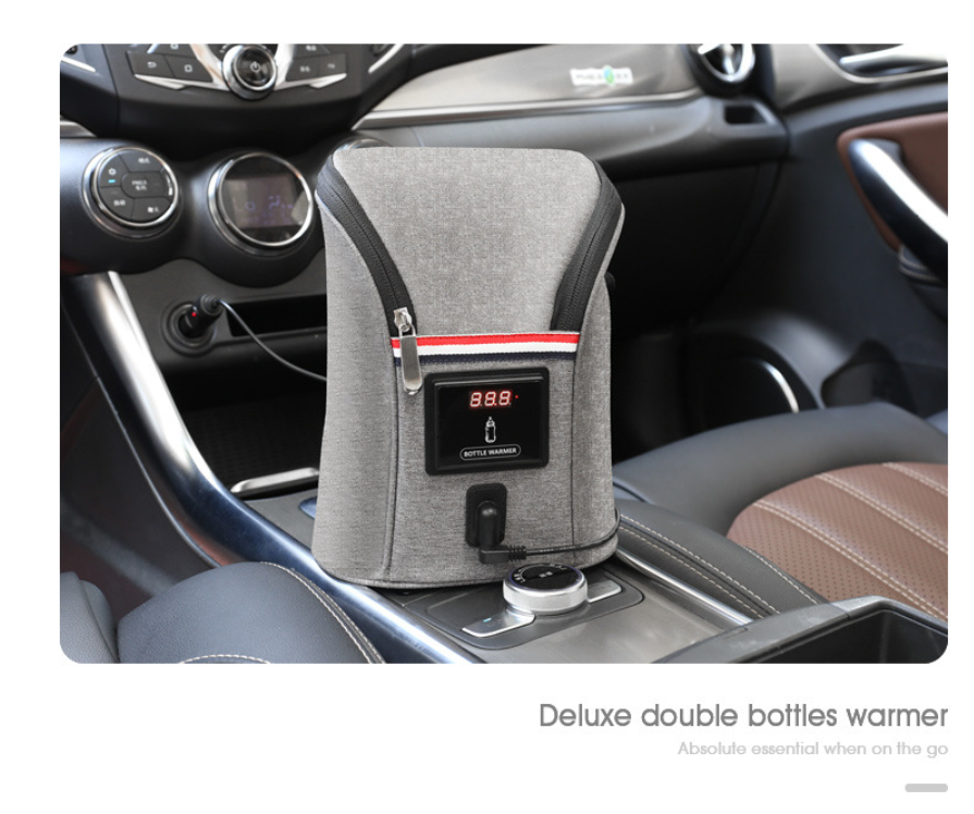 Gray portable car USB bottle warmer with digital temperature display, shown in a car interior.
