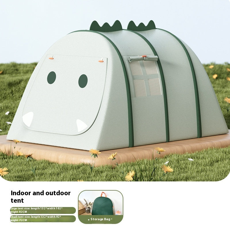 Green dinosaur-themed portable play tent for kids, with a window and storage bag, on grass.