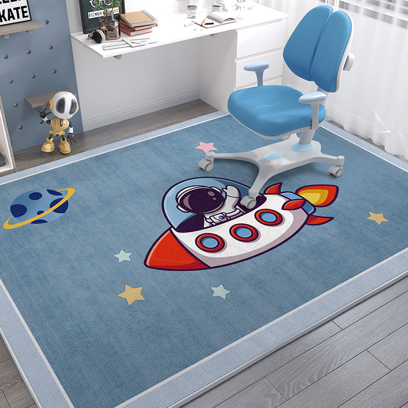 Soft blue crystal velvet kids' rug with a cartoon astronaut in a rocket and planets.