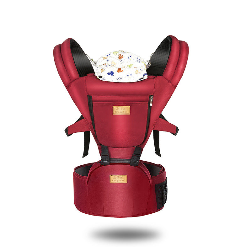 Red ergonomic baby carrier with breathable fabric, padded straps, and integrated hip seat.