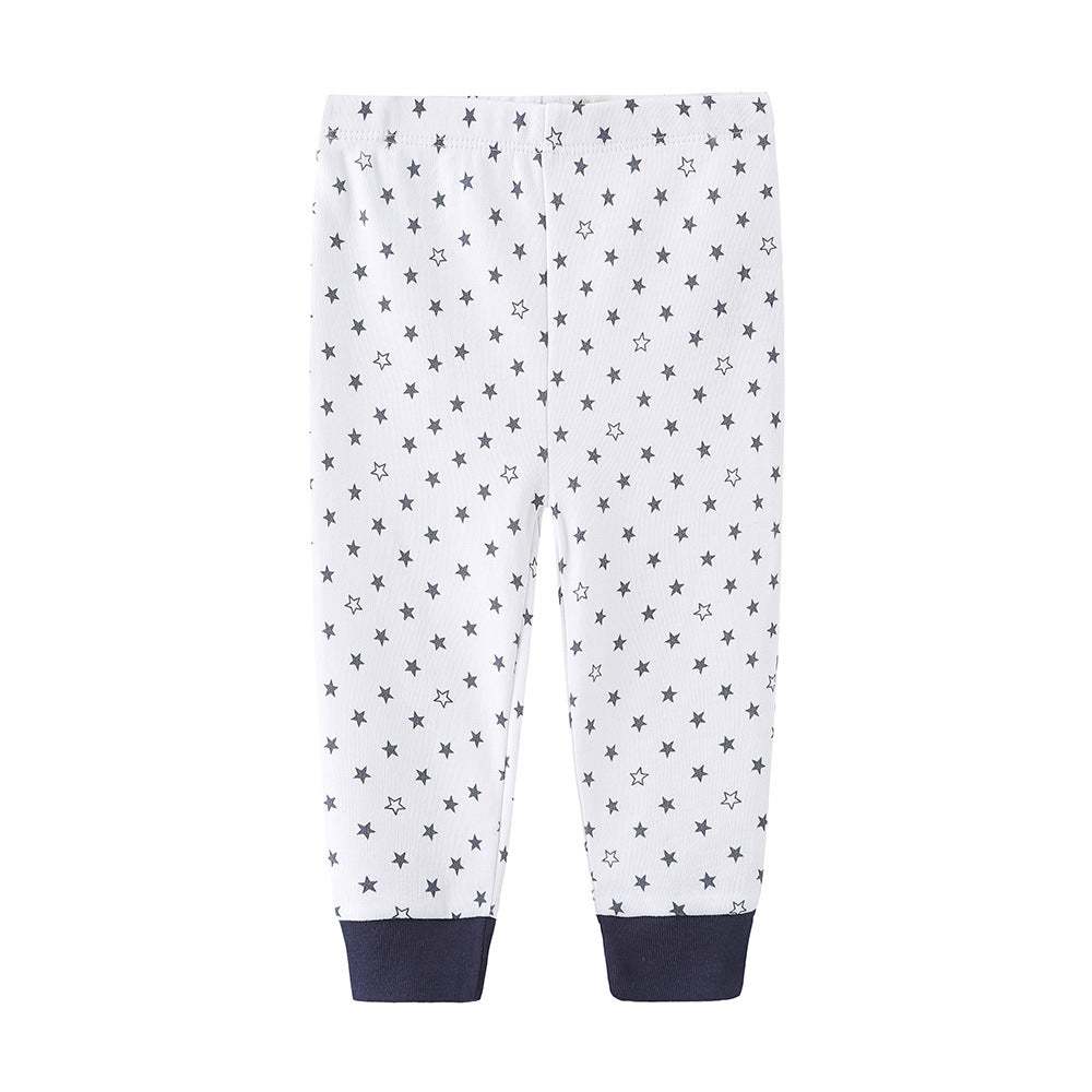 White cotton baby pants with gray star print and navy cuffs.