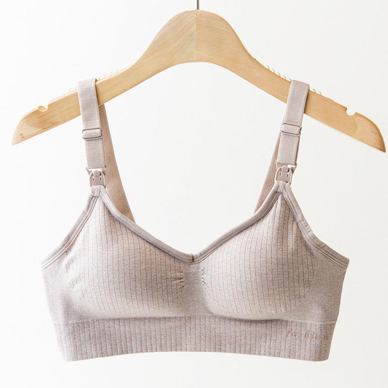 Comfortable beige wireless nursing bra with ribbed nylon fabric and adjustable straps.