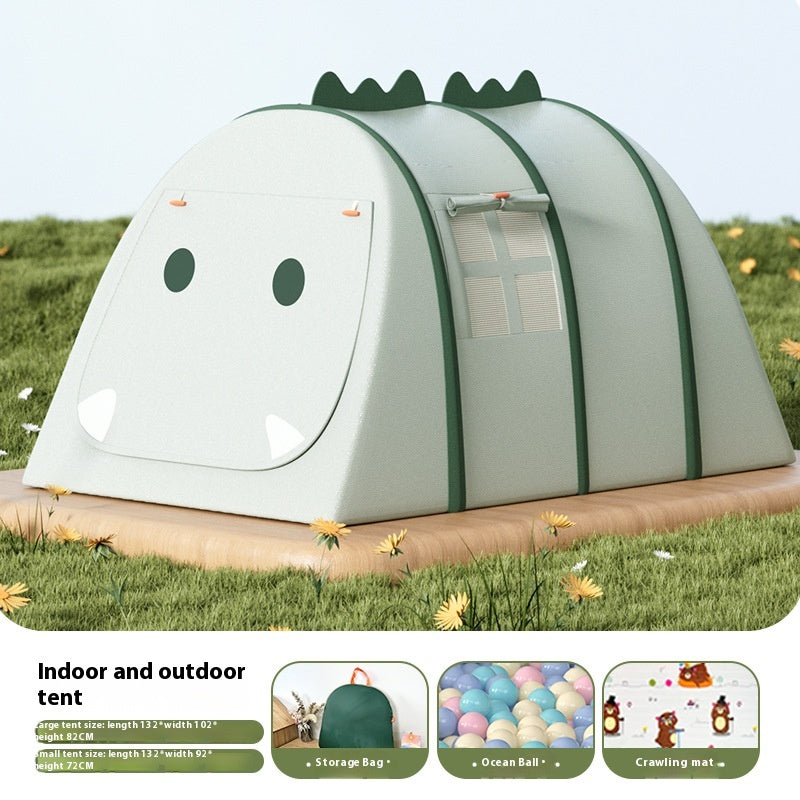 Green dinosaur-shaped play tent for kids, with a window, on a grassy outdoor surface.