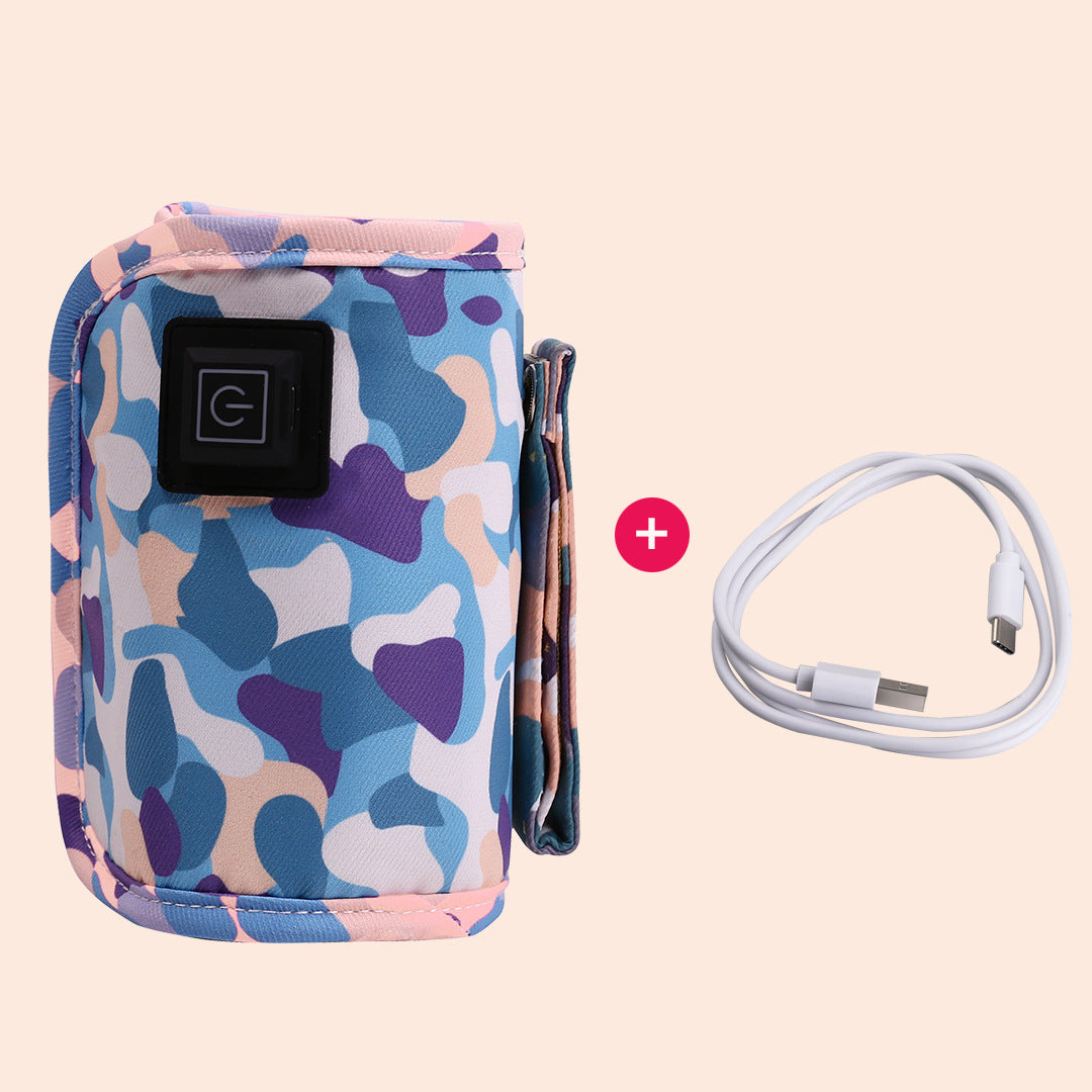 Portable baby bottle warmer with blue, pink, and purple camouflage fabric, USB cable, and power button.