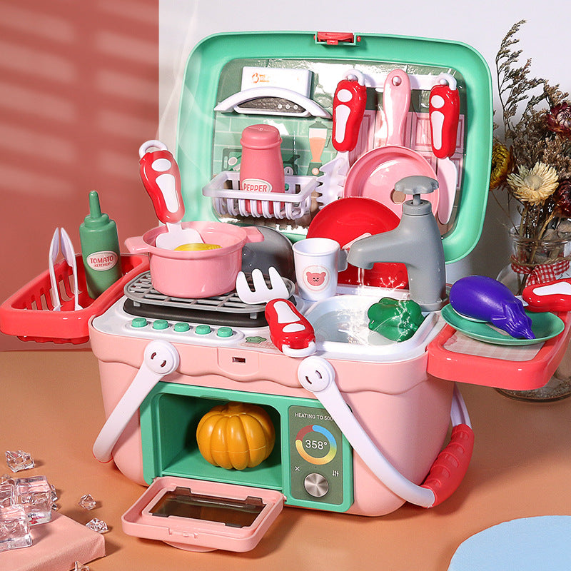 Pink and green interactive toy kitchen set with steam effects, sink, stove, oven, and accessories.