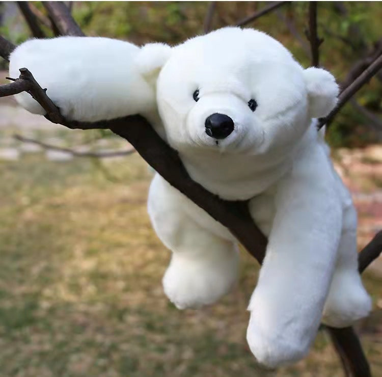 Large 110cm soft white plush polar bear toy with black eyes and nose, resting on a tree branch.
