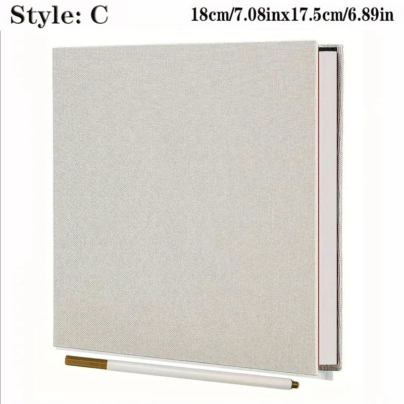 Elegant light grey linen fabric photo album with spiral binding and a gold marker.