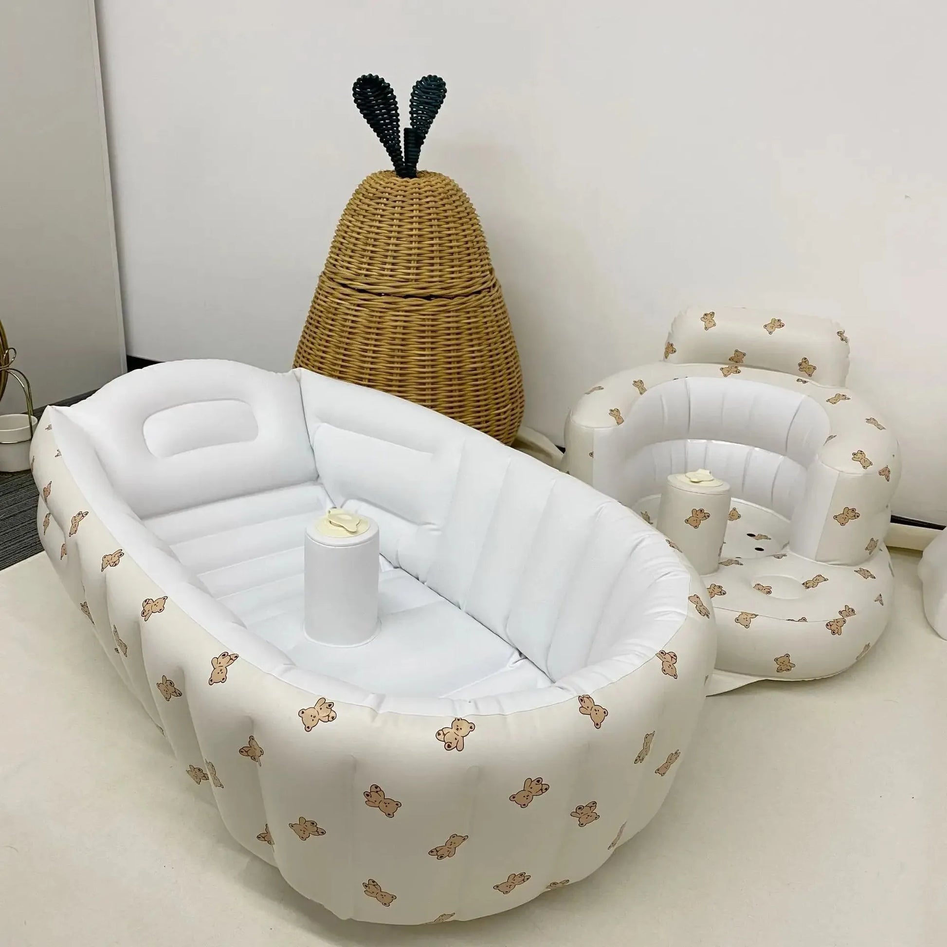 White inflatable baby bathtub and seat with brown teddy bear print, made of soft PVC.