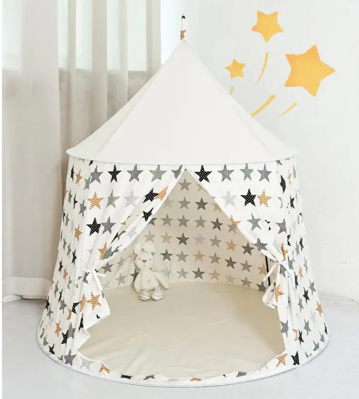 White cotton play tent for kids with colorful star pattern, castle design, and open entrance.