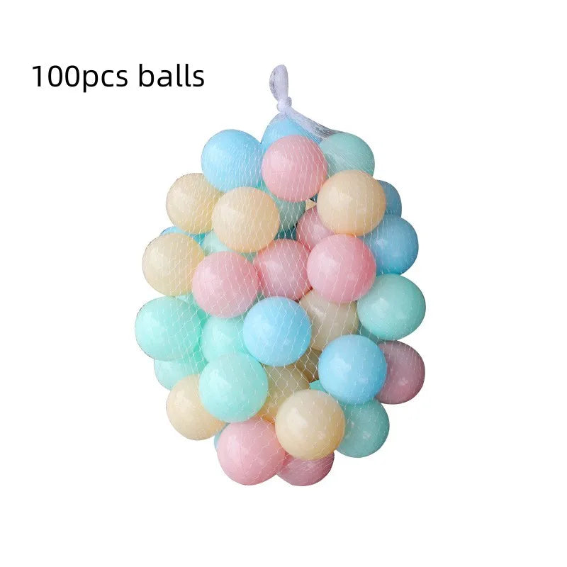 Mesh bag of 100 colorful plastic play balls in pastel blue, pink, yellow, and green.