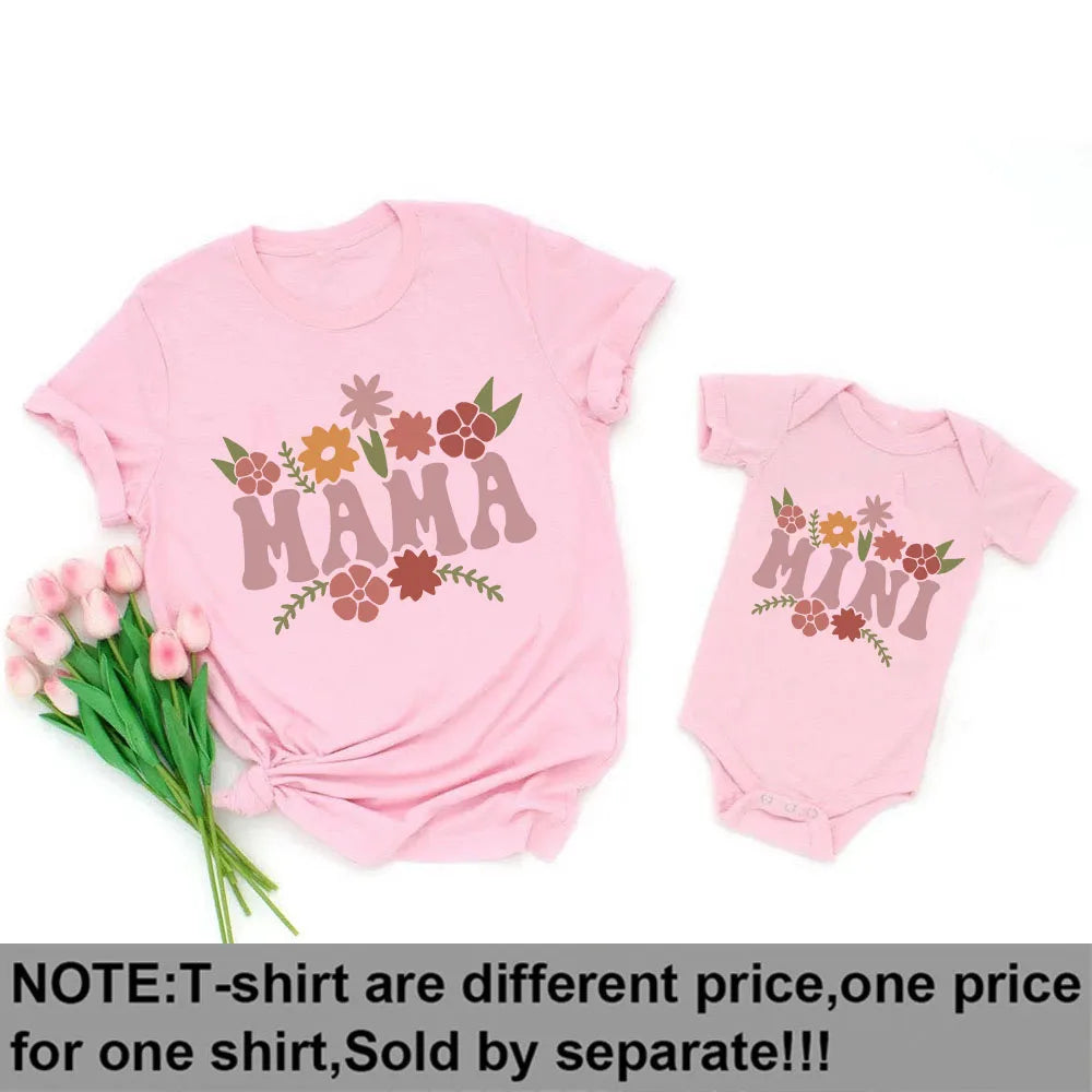 Pink "Mama" t-shirt and "Mini" baby bodysuit with floral designs, perfect for matching outfits.