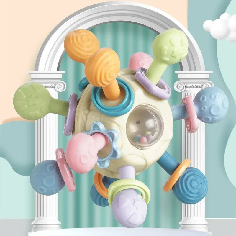 Colorful silicone spinning rattle ball for babies, with textured arms and a clear center.