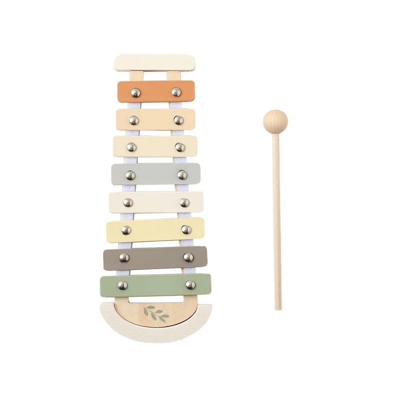 Wooden Montessori xylophone with pastel-colored bars and a natural wood mallet.