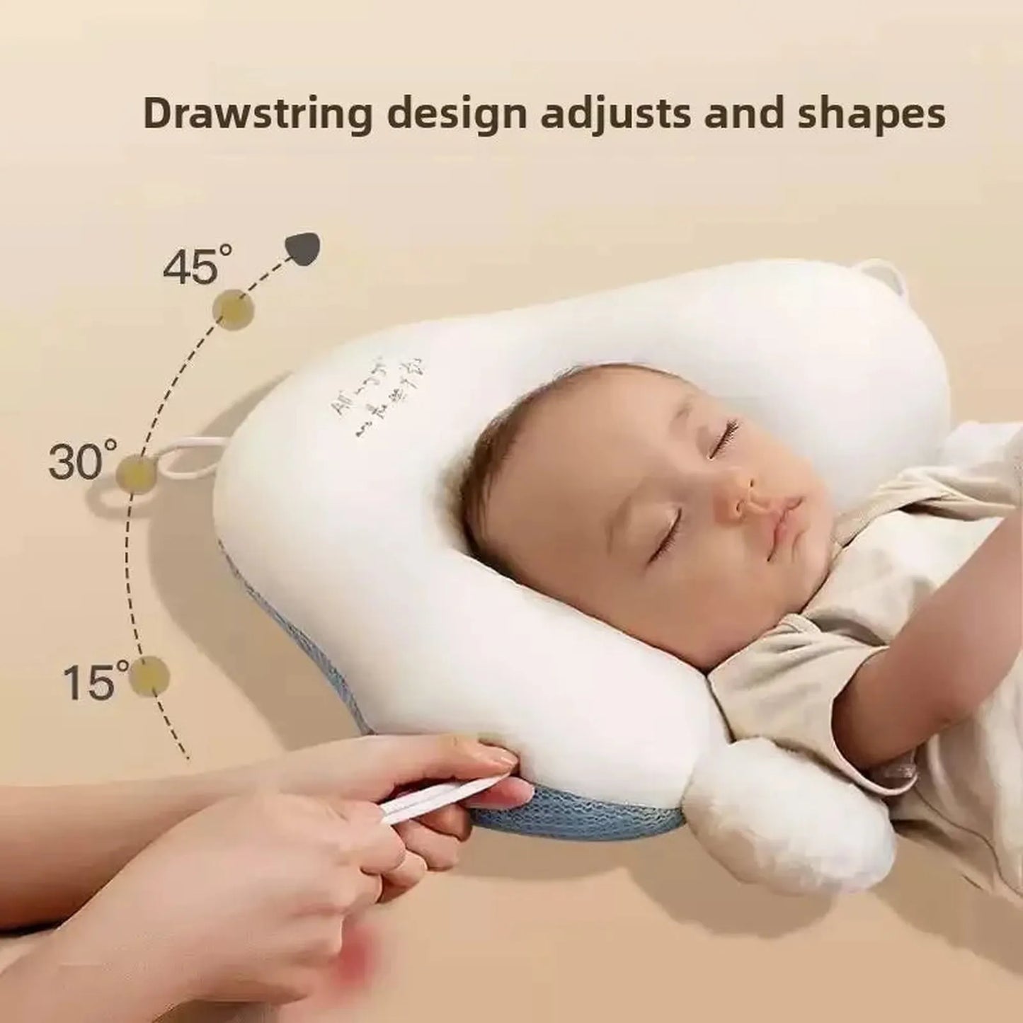 Ergonomic white and blue baby sleep pillow with drawstring adjustment, supporting a sleeping infant.