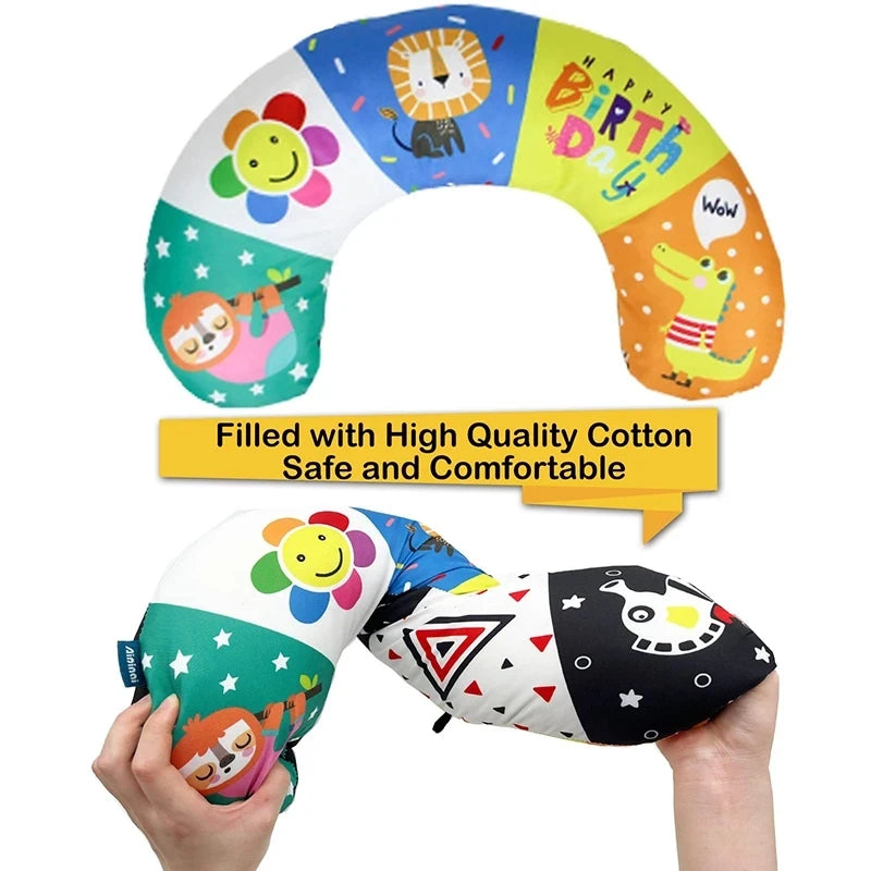 Colorful baby tummy time pillow with high-contrast black and white patterns, featuring animals and stars.