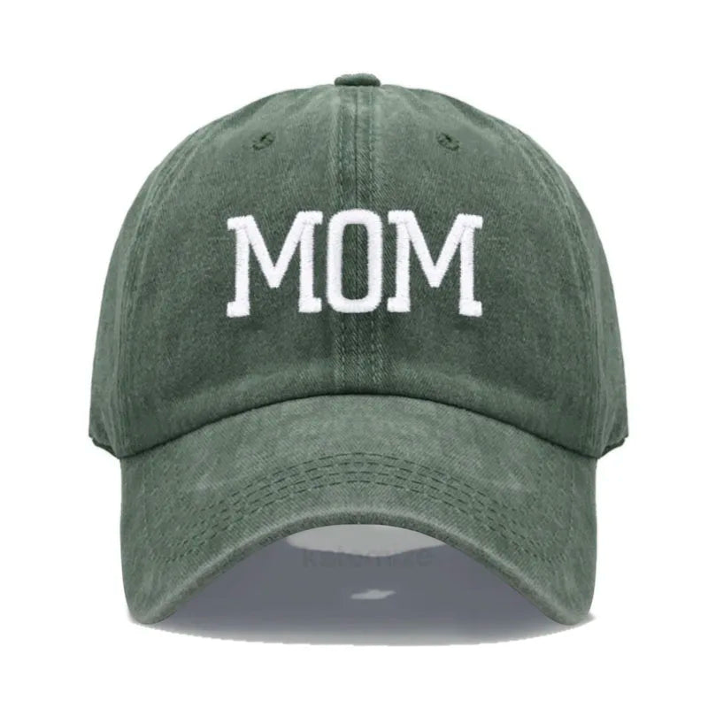Adjustable dark green cotton baseball cap with "MOM" embroidered in white.
