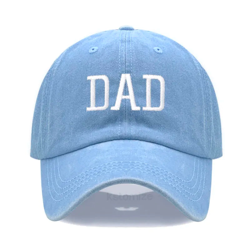 Light blue cotton baseball cap with "DAD" embroidered in white, adjustable for comfort.