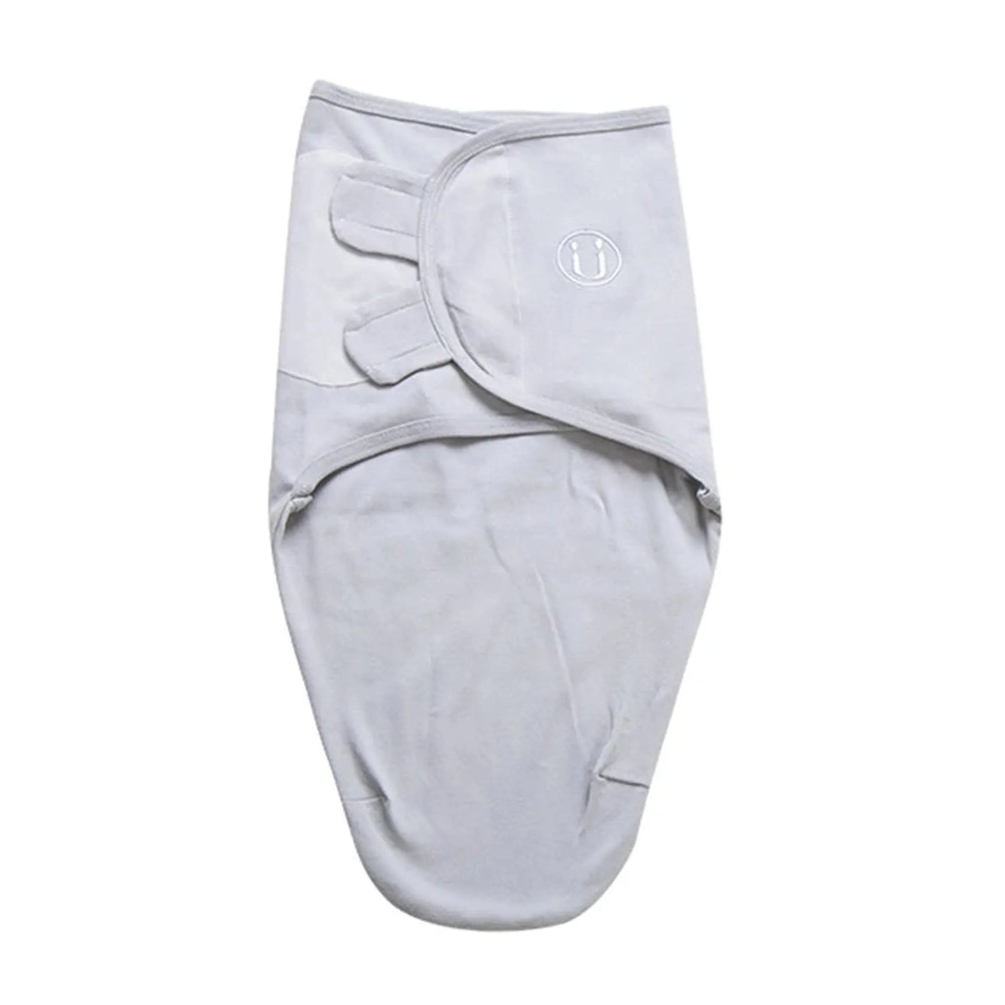 Light gray 100% cotton baby sleep sack swaddle with adjustable velcro wings and a small embroidered logo.