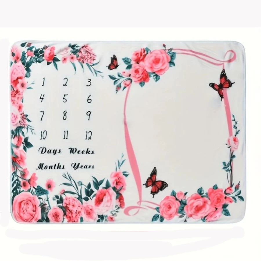 Soft white polyester baby milestone blanket with pink floral border, butterflies, and numbers 1-12.