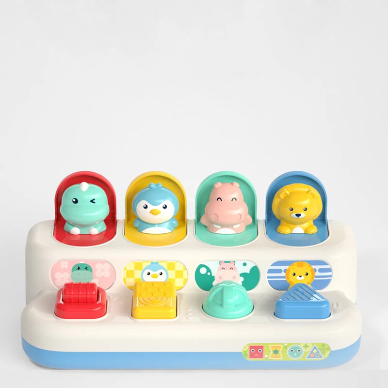 Colorful pop-up animal toy for babies and toddlers, featuring a dinosaur, penguin, hippo, and lion.