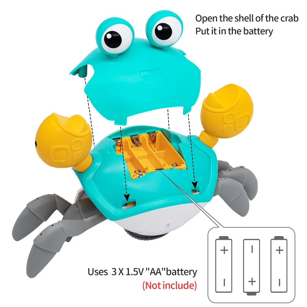 Interactive crawling teal crab toy with yellow claws, showing open battery compartment for 3 AA batteries.