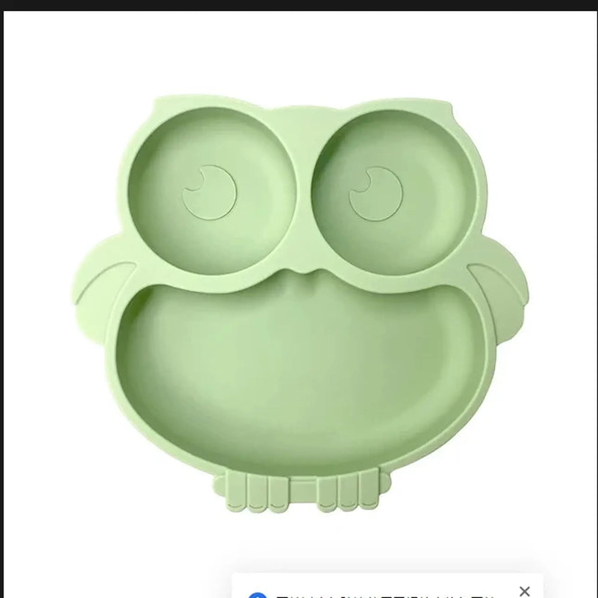 Light green silicone owl plate with vacuum base for baby self-feeding, divided sections.