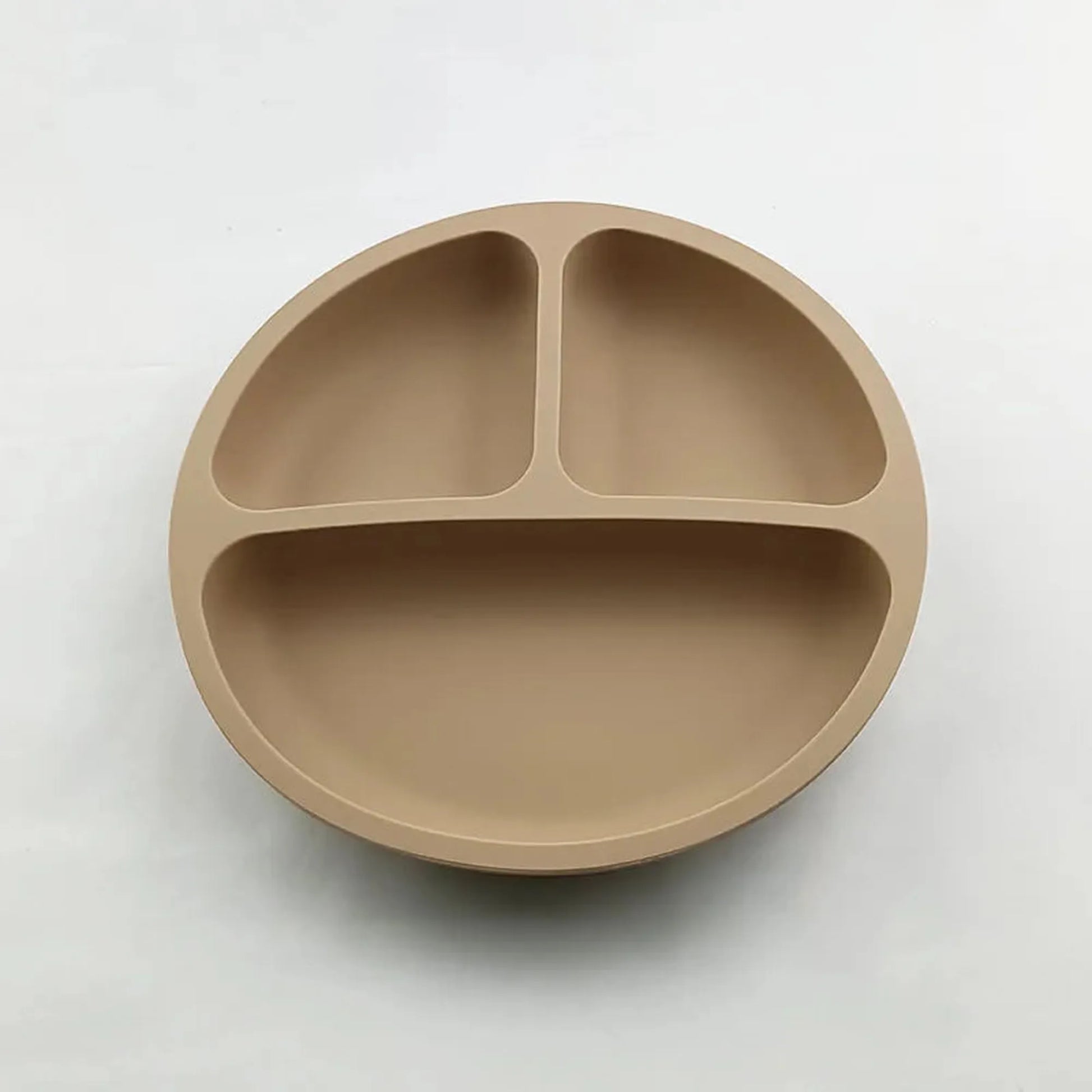 Tan silicone baby plate with three divided sections and a strong vacuum base.