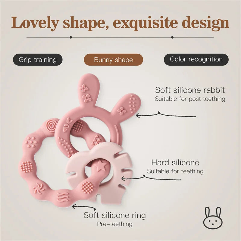 Pink silicone bunny teether with textured rings for grip training and teething relief.