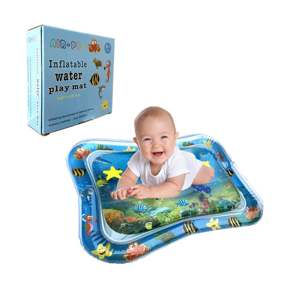 Happy baby on a blue inflatable water play mat with colorful floating sea animals, next to its product box.