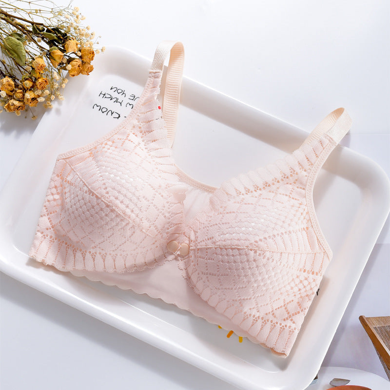 Elegant peach lace nursing bra with convenient front closure and wide straps.