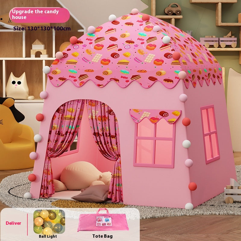 Pink candy house play tent for kids with dessert-themed roof, windows, and decorative balls.