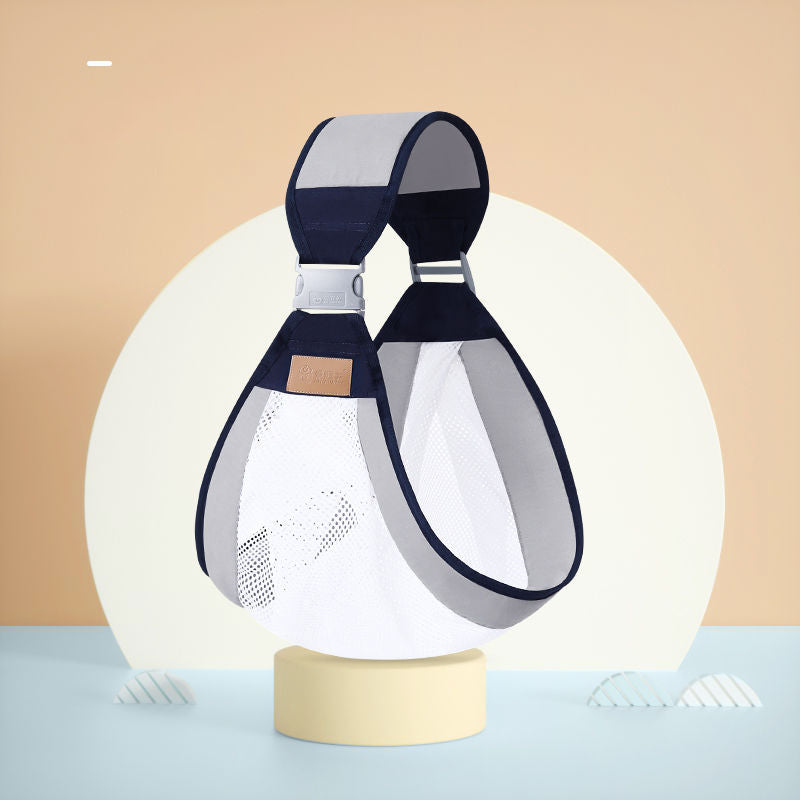 Ergonomic navy and gray baby carrier with breathable white mesh, designed for single-shoulder front carry.