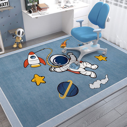 Soft blue crystal velvet kids' rug with a cartoon astronaut, rocket, and planets design.