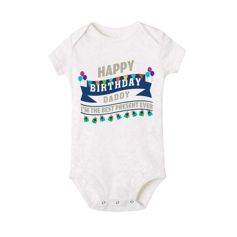 White short-sleeve baby bodysuit with "Happy Birthday Daddy I'm the best present ever" text and colorful banners.
